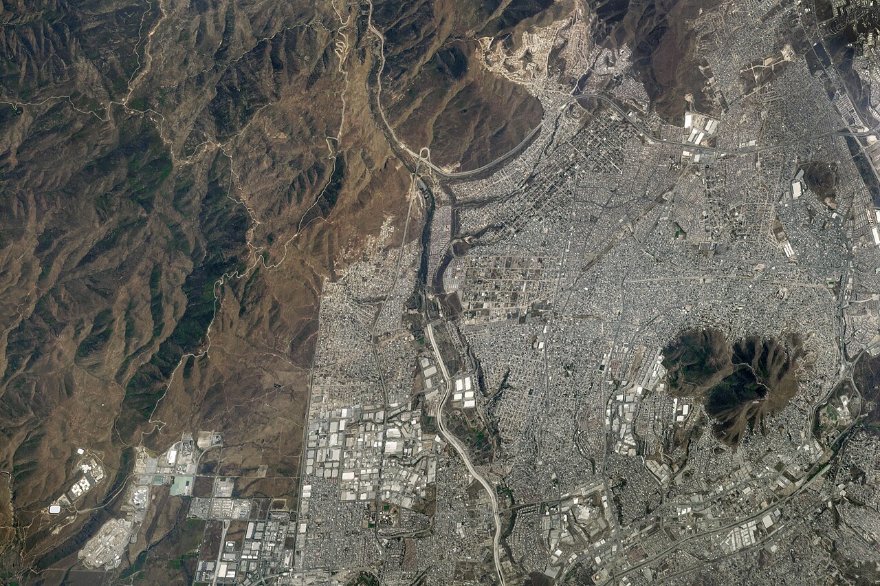Orbital photograph of the terrain and urban fabric along the Tijuana–San Diego border